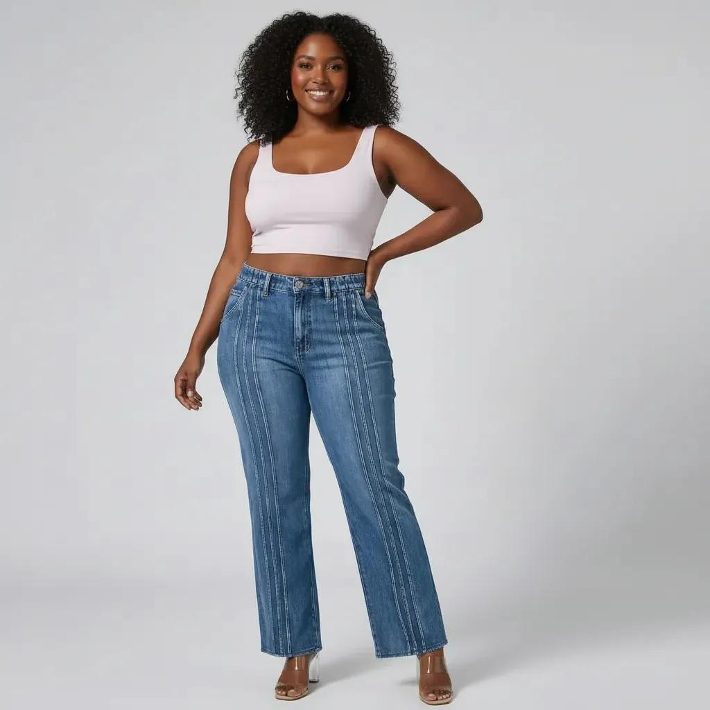 Woman wearing blue jeans and a white tank top on a plain background