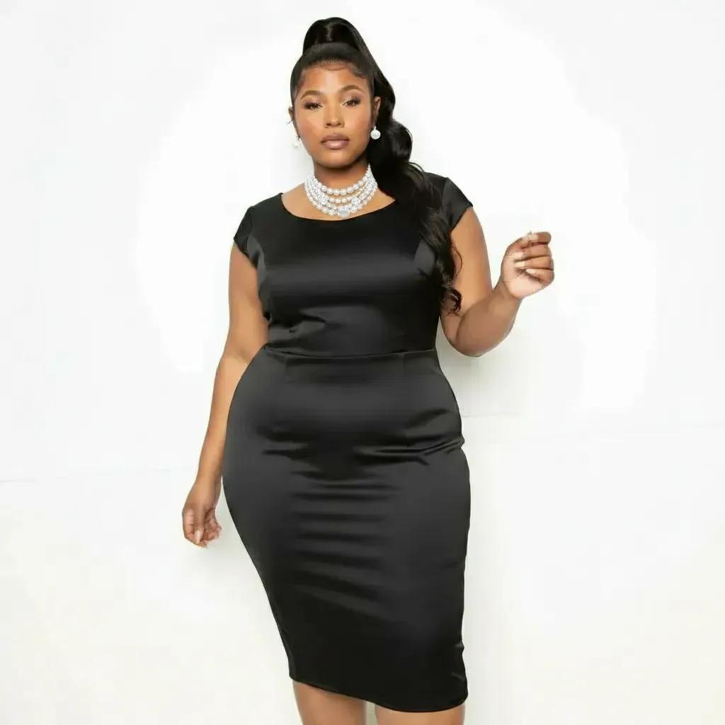 Woman wearing a black dress with a white background